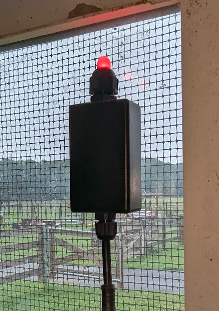 Prototype of the Mini-Egg, an egg-shaped accessory on a platform, glowing as a local coop status light.
